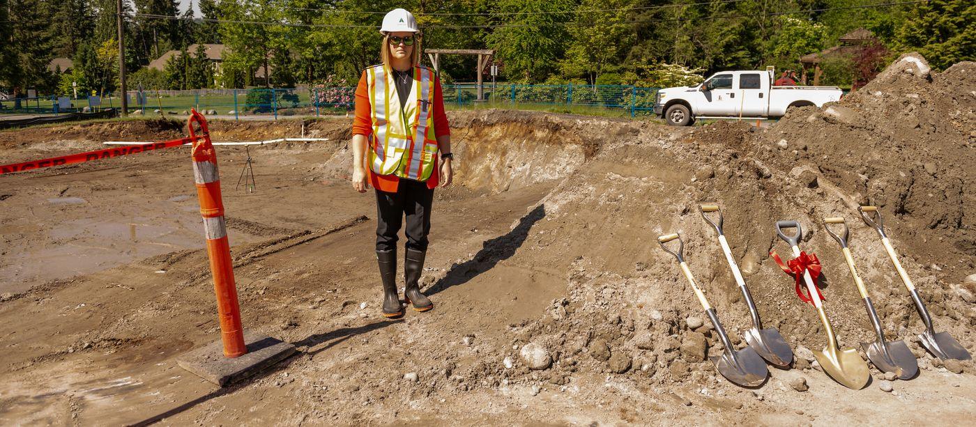 Juli Halliwell-Ferrero on site at the excavation for the Anmore Community Hub, with ceremonial shovels lined up for the groundbreaking