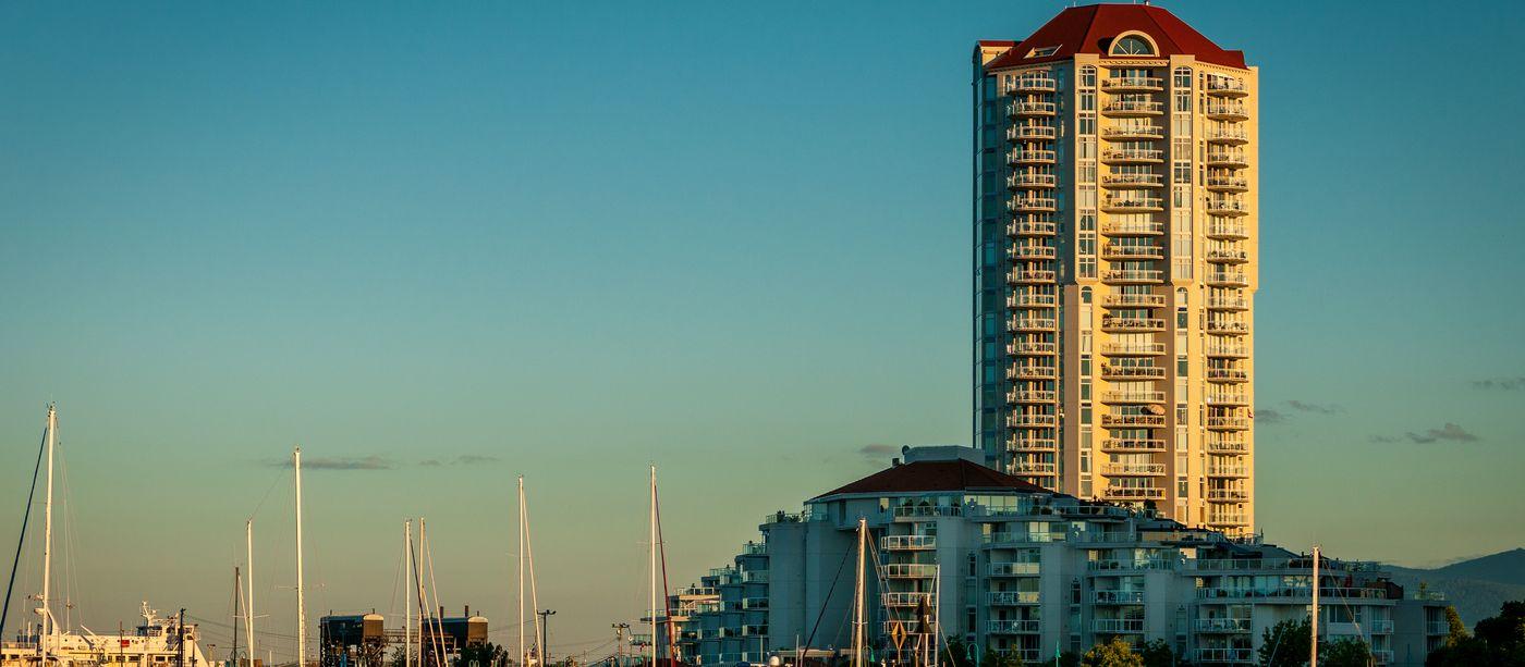 Nanaimo harbour at golden hour, with the marina and waterfront towers