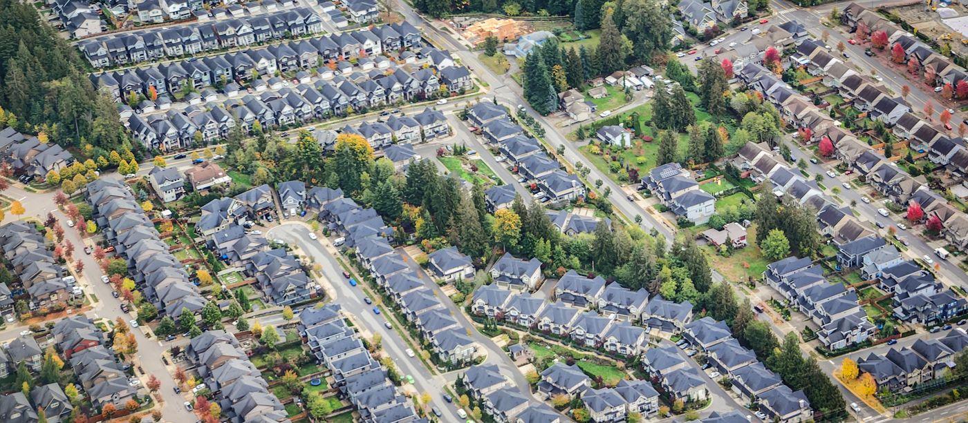 Aerial view of a dense residential neighbourhood with streets, cul-de-sacs and new construction